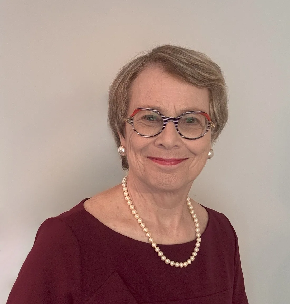 Meg Oliver smiling in her professional portrait